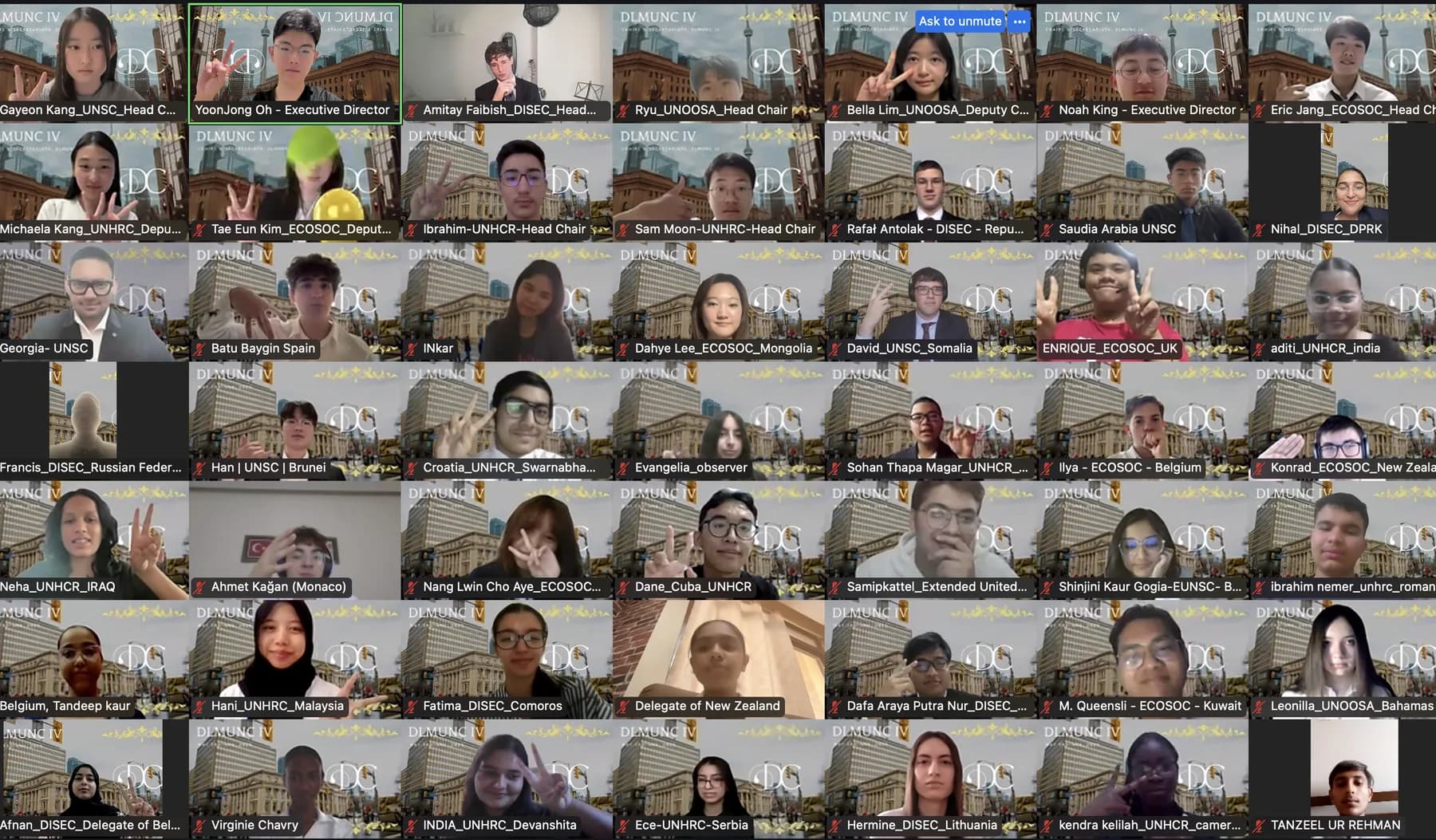 A Zoom gallery of about fifty DLMUNC IV chairs and delegates, several waving, most in front of the Toronto Union Station background.